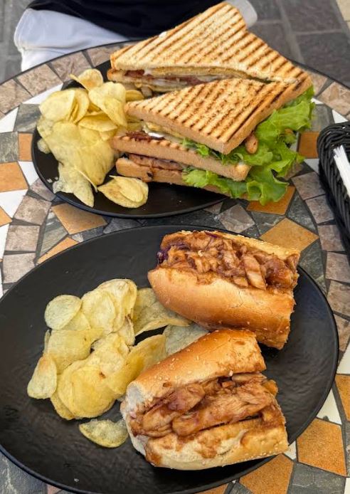 Club sandwich and sub on a mosaic table