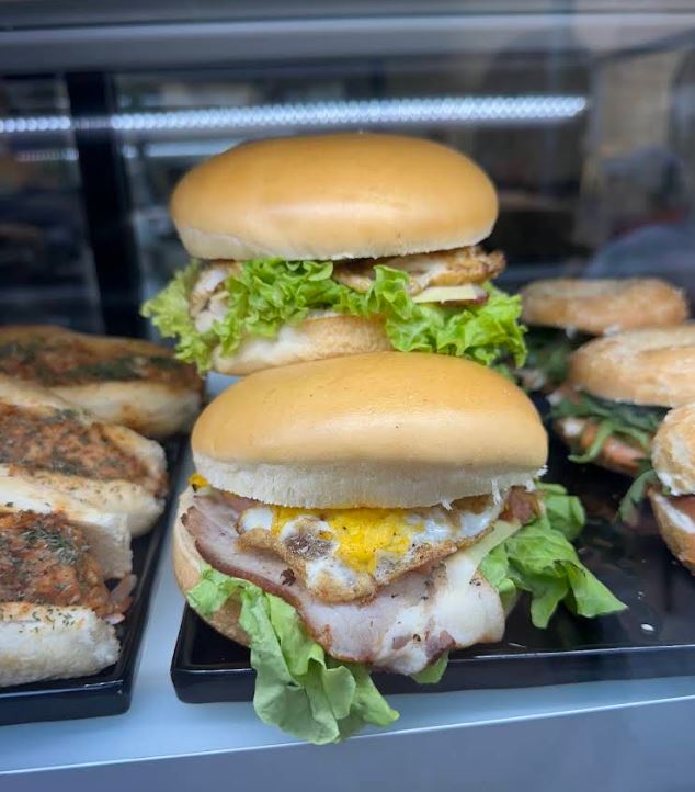 Stacked burgers and breakfast bagels
